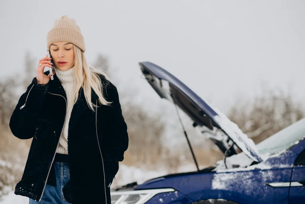 young-woman-calling-phone-after-her-car-brokedown-winter-season.jpg